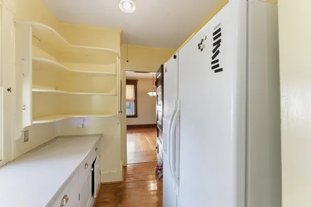 a bathroom with a shower and a sink