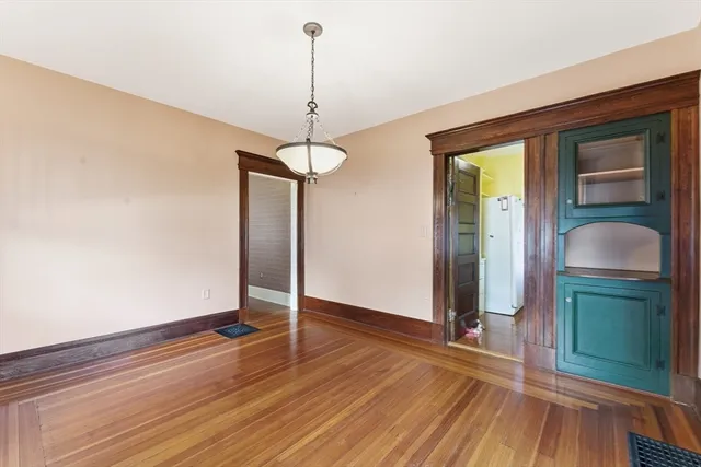 a room with hard wood floors and a wooden floors
