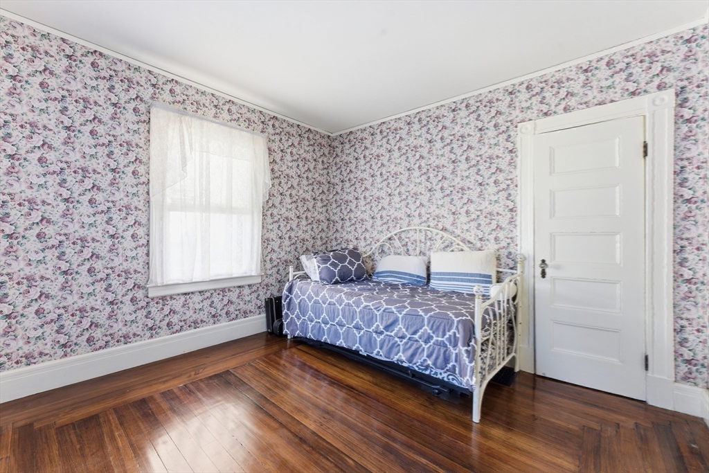 106 Magnolia Terrace Springfield, MA 01108 - Photo 25 of 42 a bedroom with a bed and a window