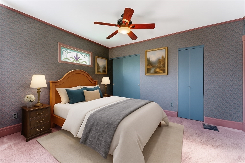 106 Magnolia Terrace Springfield, MA 01108 - Photo 30 of 42 a bedroom with a bed and a lamp on dresser