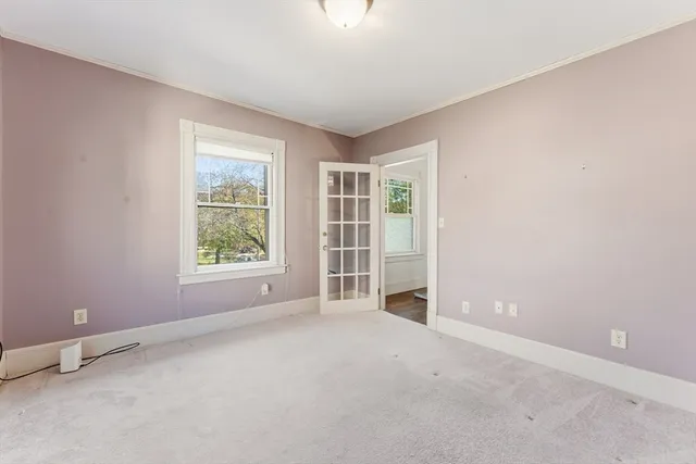 a bathroom with a sink mirror and toilet
