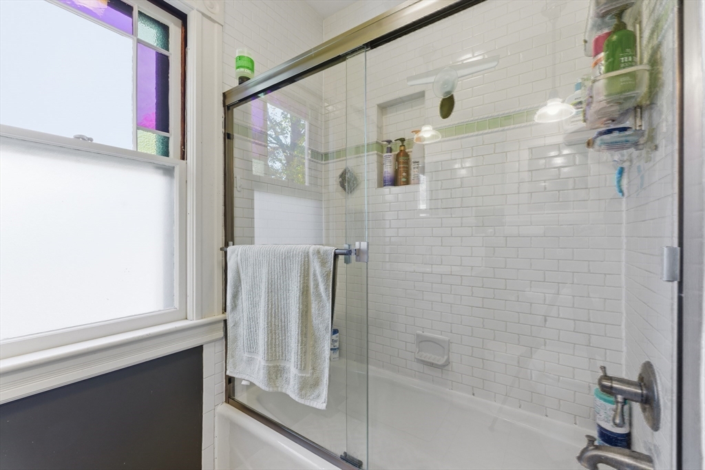 106 Magnolia Terrace Springfield, MA 01108 - Photo 33 of 42 a bathroom with a bathtub and a shower