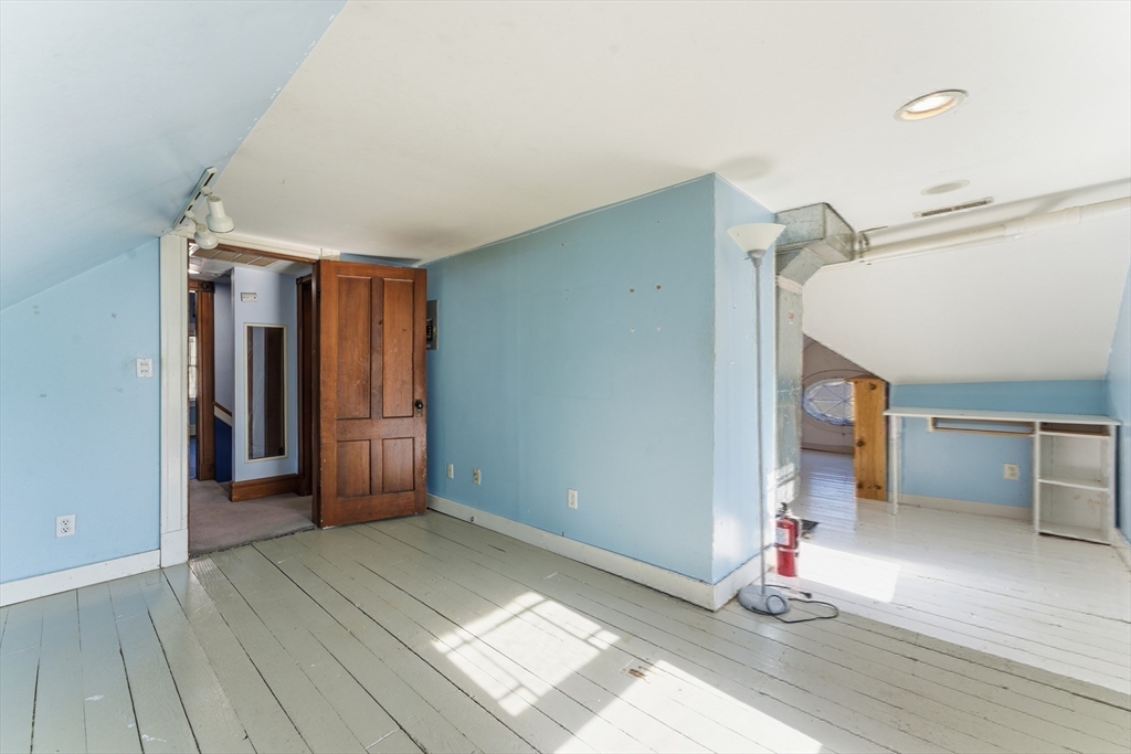 106 Magnolia Terrace Springfield, MA 01108 - Photo 35 of 42 a view of entryway and hall with wooden floor