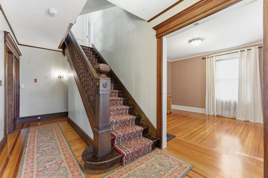 106 Magnolia Terrace Springfield, MA 01108 - Photo 8 of 42 a view of entryway and hall with wooden floor