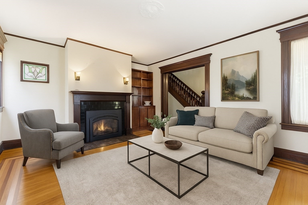 106 Magnolia Terrace Springfield, MA 01108 - Photo 10 of 42 a living room with furniture and a fireplace