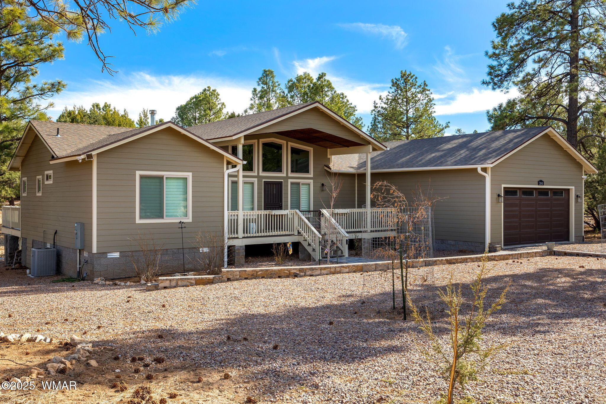 2841 Lodgepole Road Overgaard, AZ 85933 - Photo 1 of 44 a view of a house with a yard and large tree