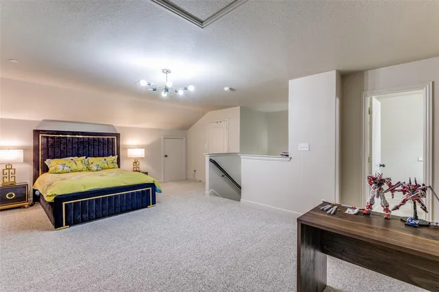 a bedroom with a bed and a table