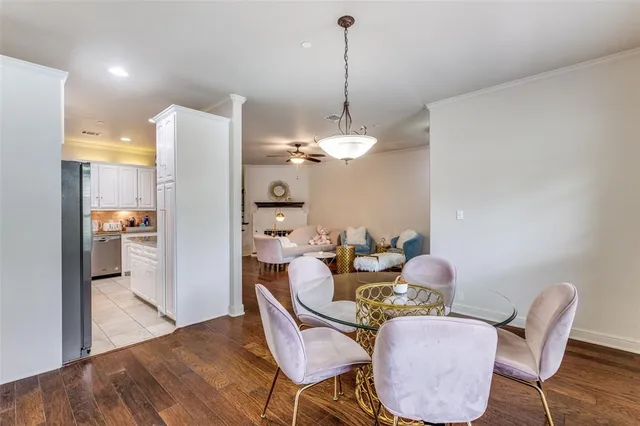 a dining room with furniture and wooden floor