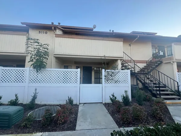 a front view of a house with garage