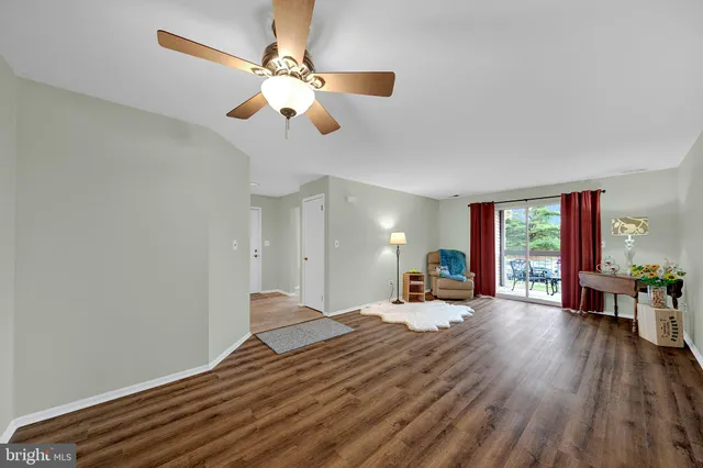 a bathroom with a granite countertop toilet a sink and a bathtub