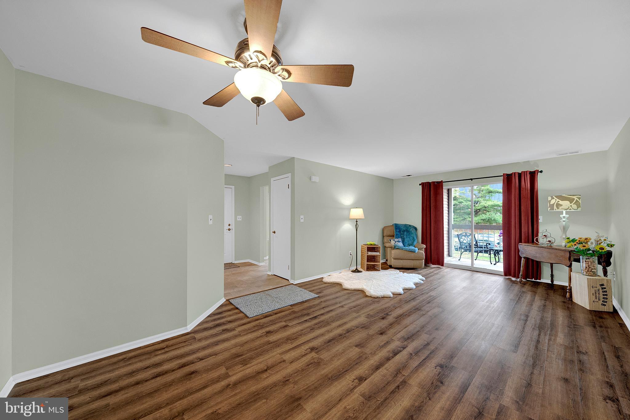 335 Silvia Street Ewing, NJ 08628 - Photo 12 of 25 a bedroom with a bed and wooden floor