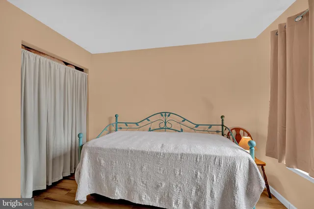 a view of room with wooden floor and window