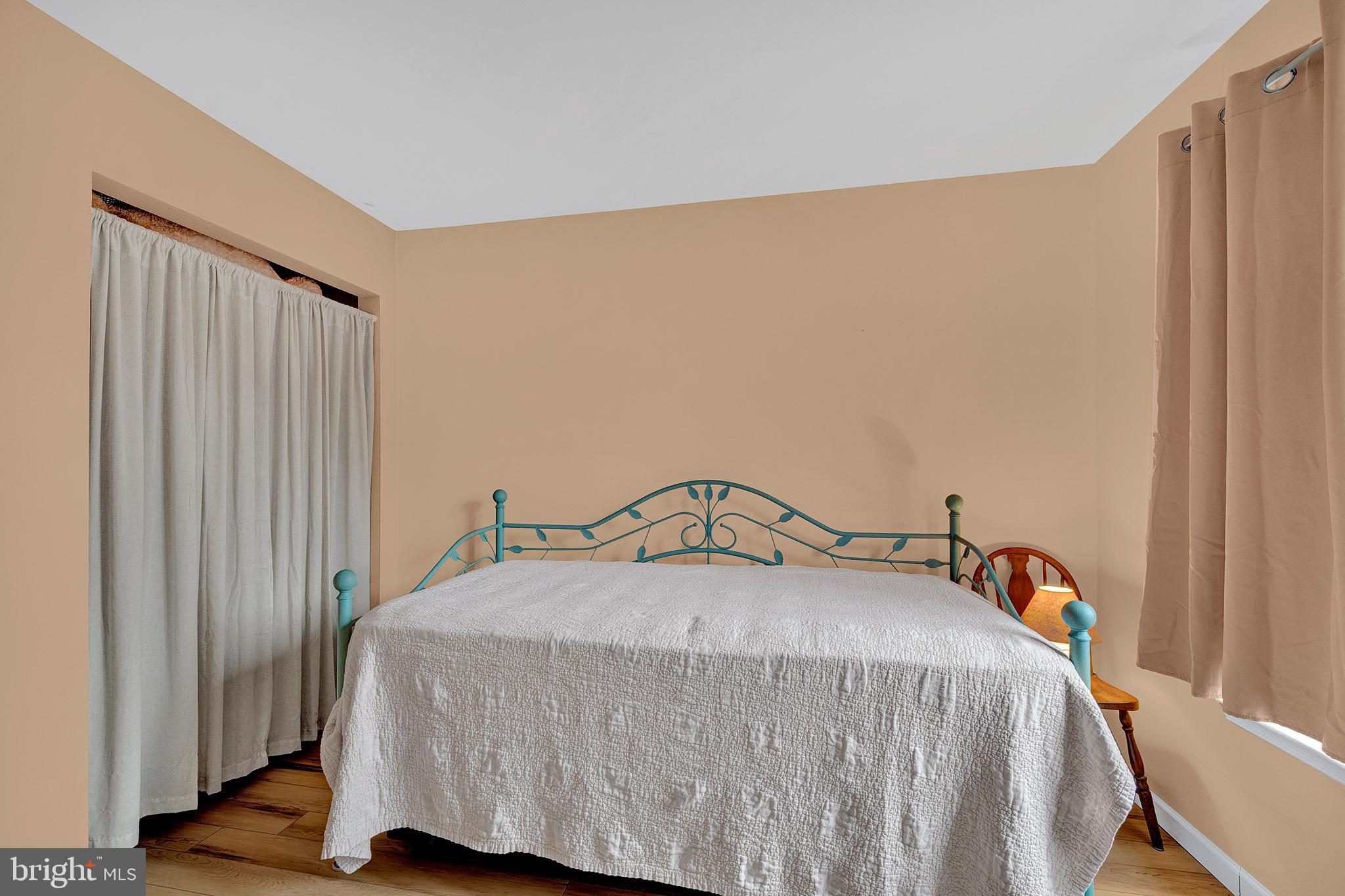 335 Silvia Street Ewing, NJ 08628 - Photo 14 of 25 a bedroom with a bed and a window