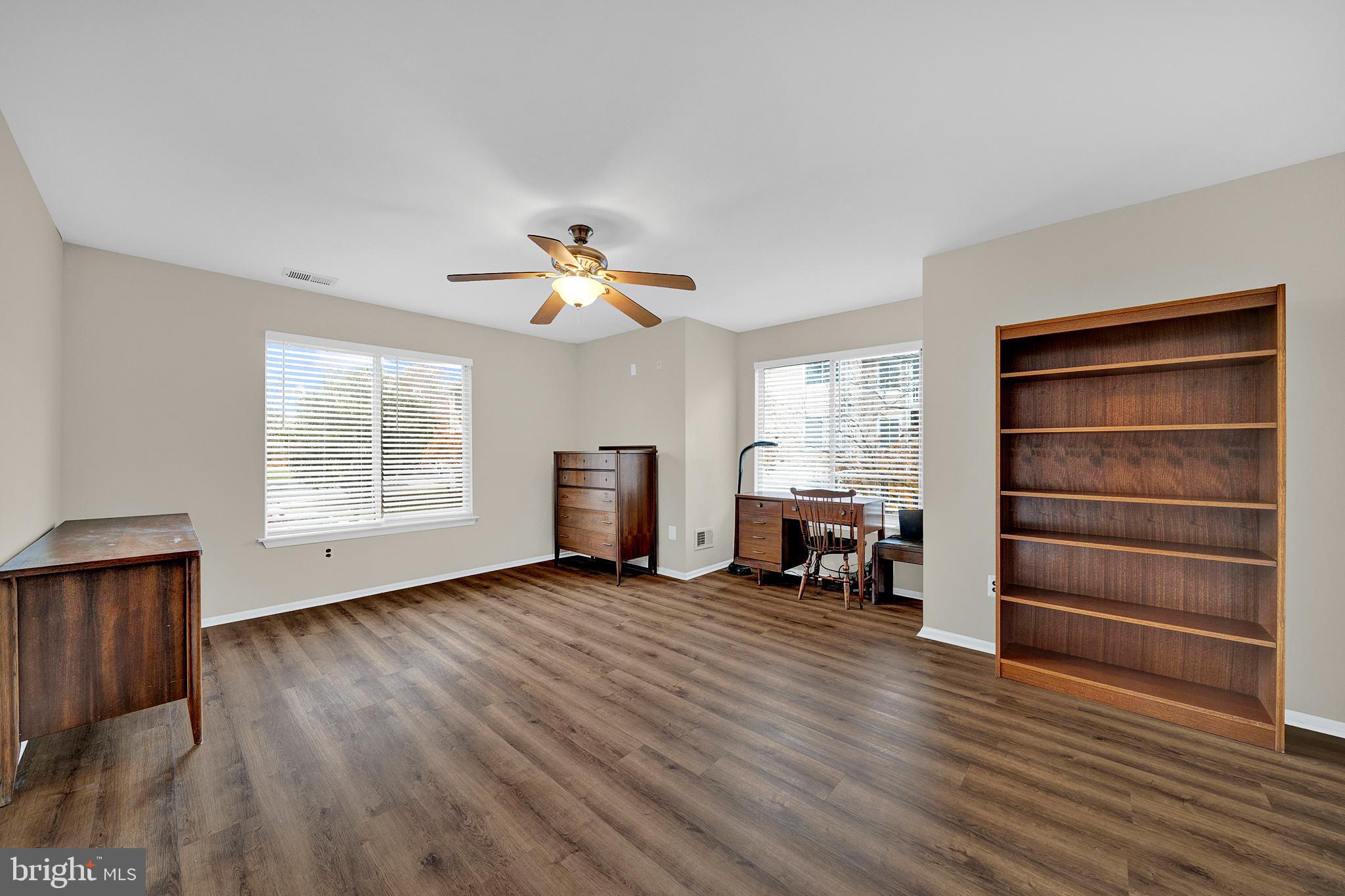 335 Silvia Street Ewing, NJ 08628 - Photo 16 of 25 a view of room with furniture and wooden floor