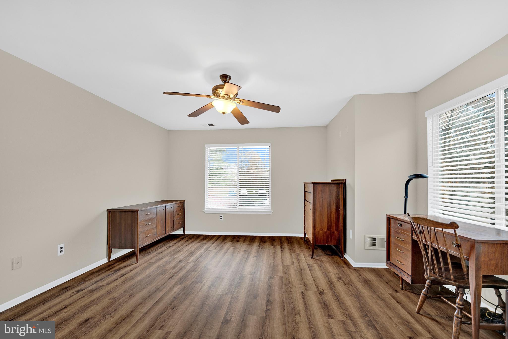 335 Silvia Street Ewing, NJ 08628 - Photo 18 of 25 a view of room with wooden floor and window