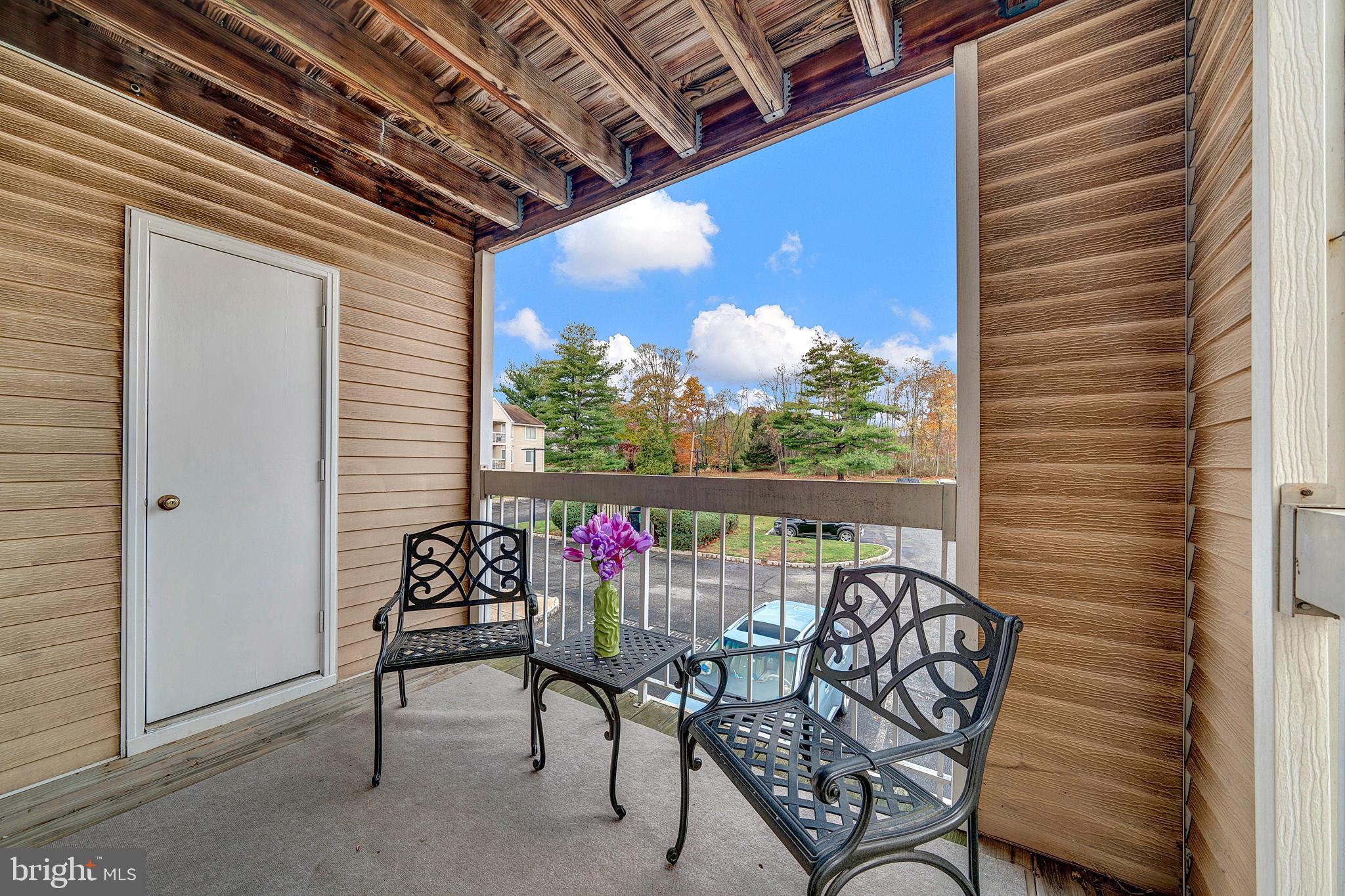 335 Silvia Street Ewing, NJ 08628 - Photo 22 of 25 a view of a chairs in balcony