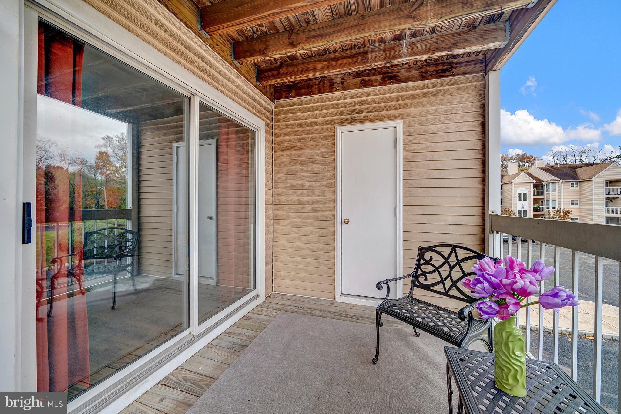 335 Silvia Street Ewing, NJ 08628 - Photo 24 of 25 a view of a porch with a table and chairs
