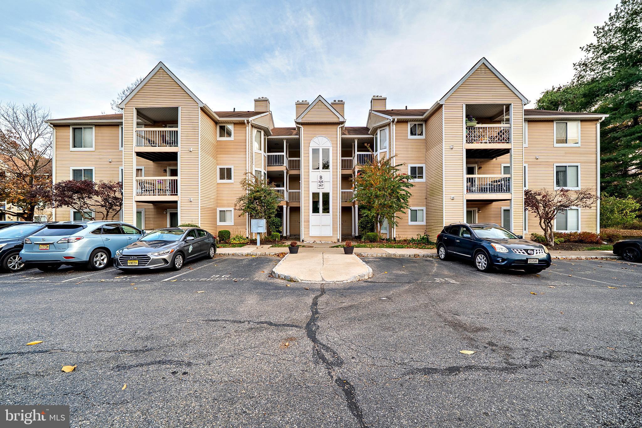 335 Silvia Street Ewing, NJ 08628 - Photo 25 of 25 a view of a street with cars parked in front of it