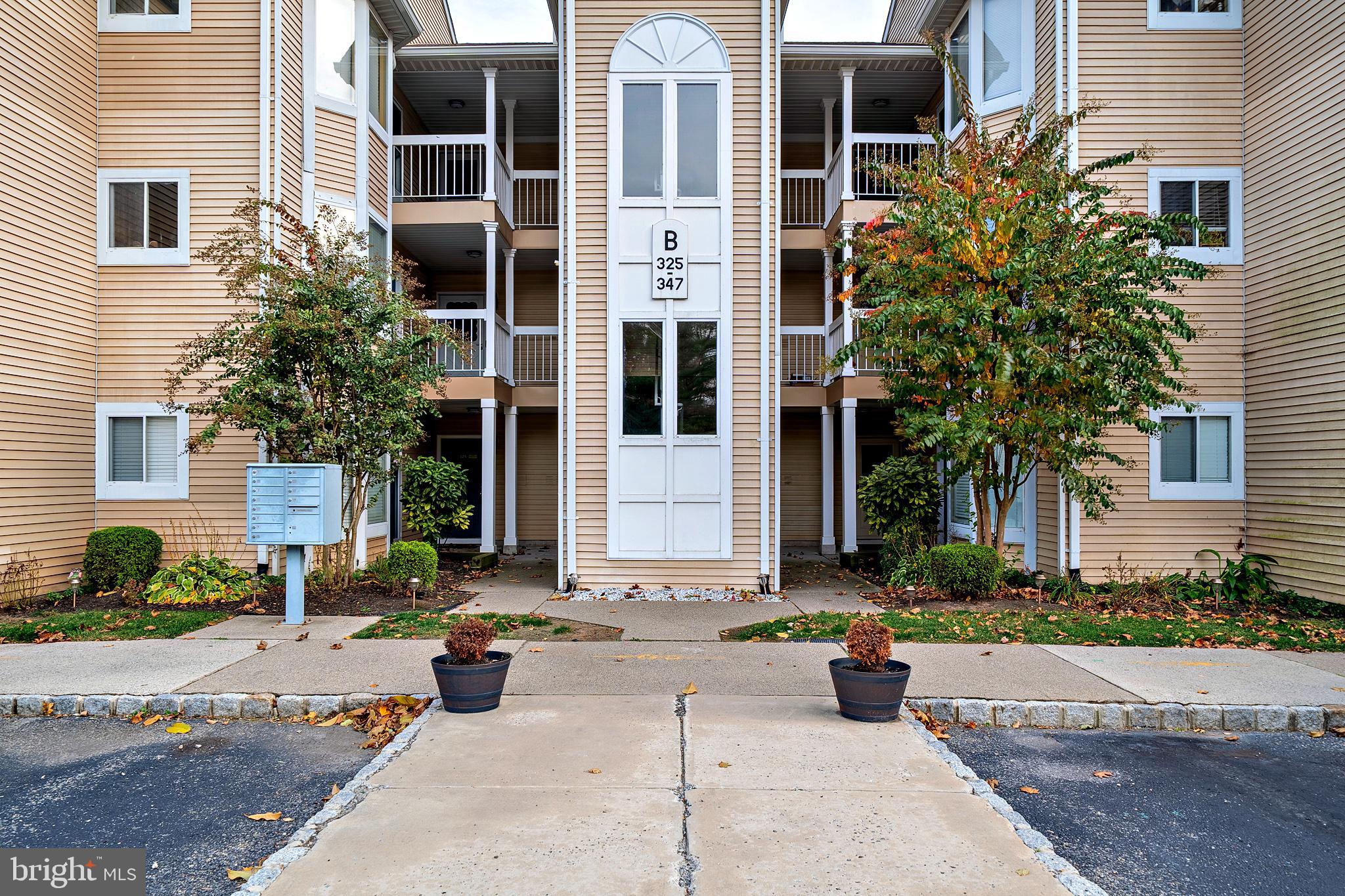335 Silvia Street Ewing, NJ 08628 - Photo 3 of 25 a front view of a building with street