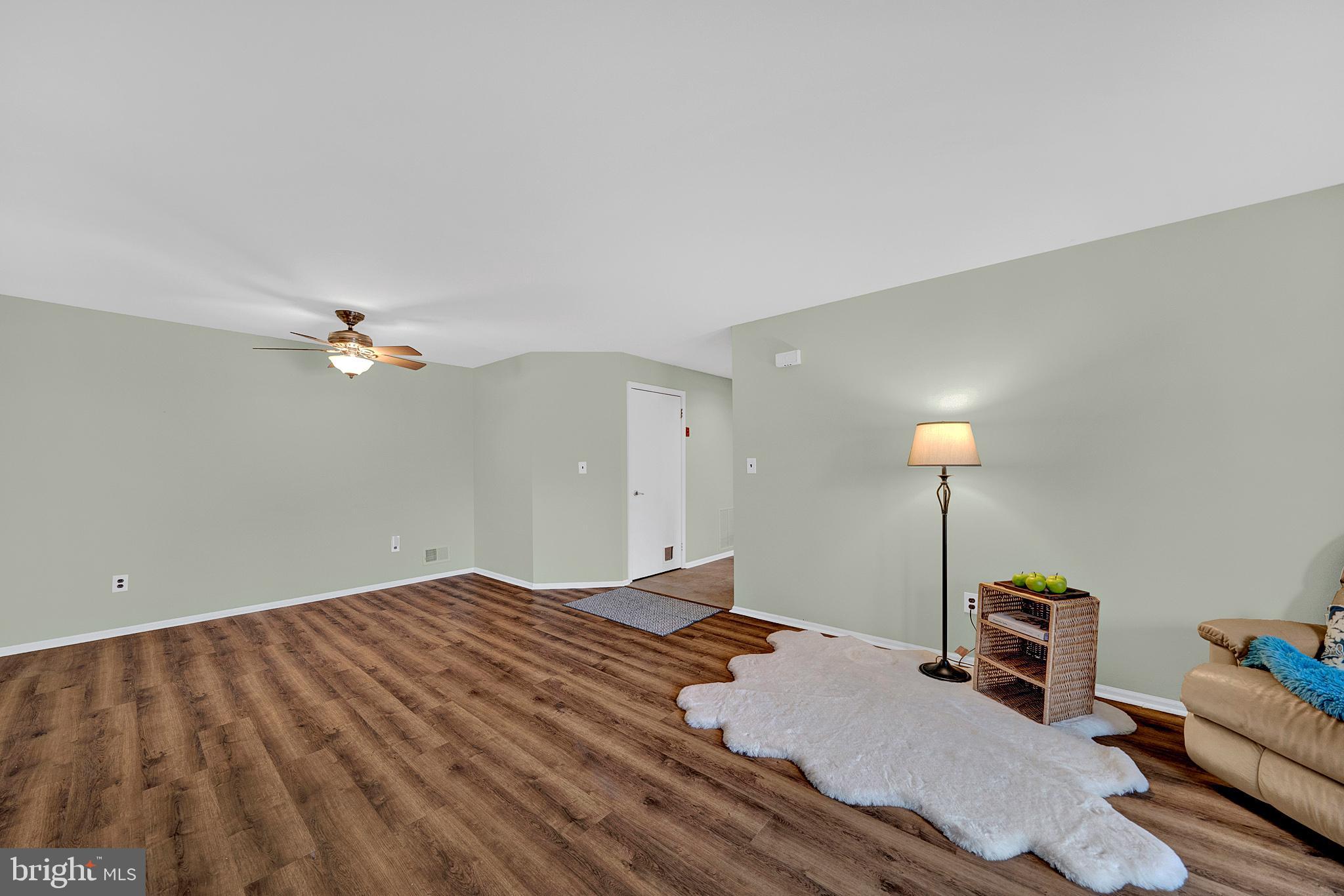 335 Silvia Street Ewing, NJ 08628 - Photo 9 of 25 a bedroom with a bed and a chandelier