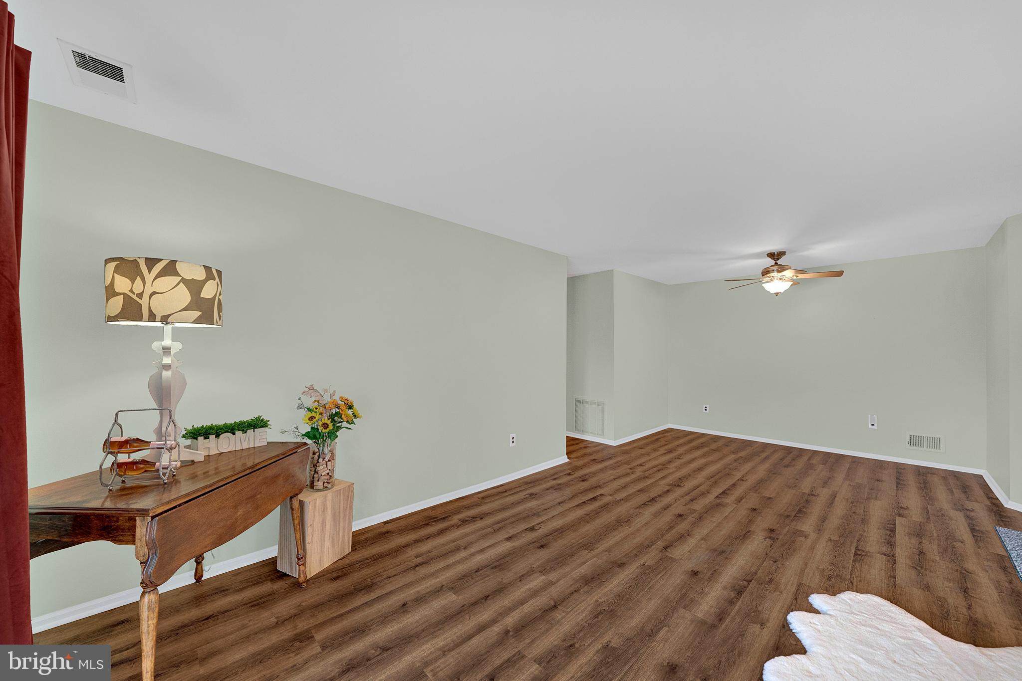 335 Silvia Street Ewing, NJ 08628 - Photo 10 of 25 a workspace room with wooden floor and furniture