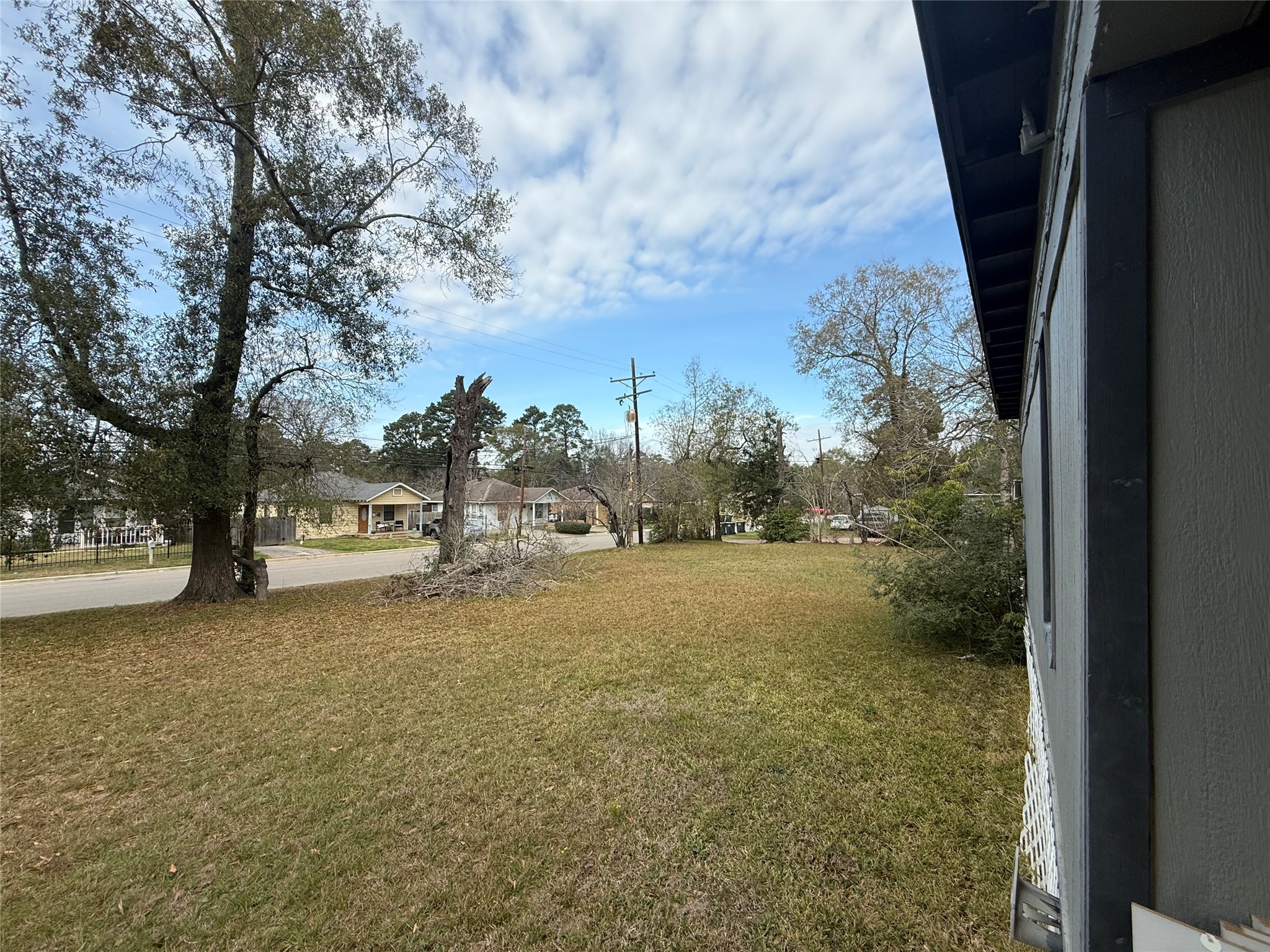412 Waco Street Conroe, TX 77301 - Photo 32 of 50 a view of a yard with trees and a house
