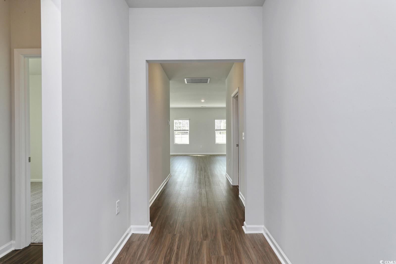 703 St Albans Loop Conway, SC 29526 - Photo 2 of 24 Hallway featuring visible vents, dark wood-style f