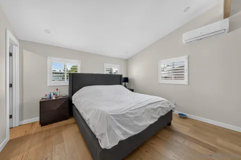 a bedroom with a bed and window