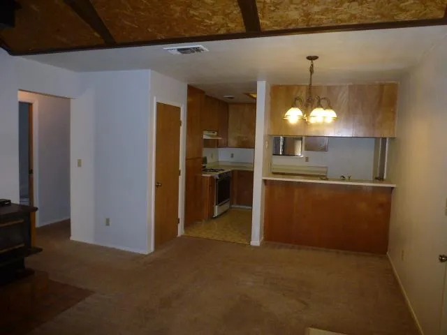 a view of a kitchen with a sink