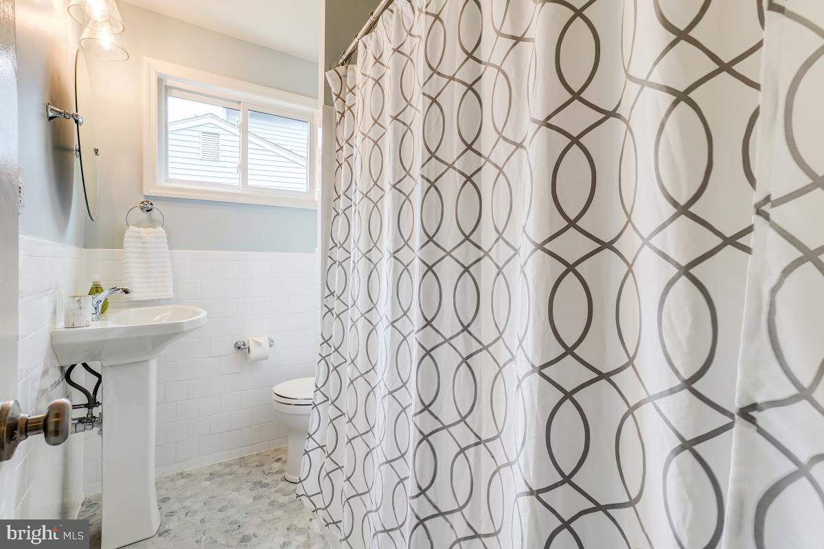 4801 Wyaconda Road Rockville, MD 20852 - Photo 27 of 48 Renovated Full Bath w/ marble honed flooring