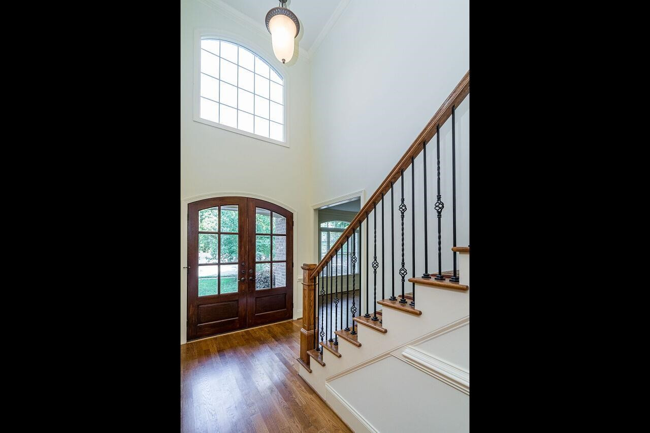 3820 Laurel Hills Road Raleigh, NC 27612 - Photo 4 of 30 Lovely two story foyer greets you with a grand staircase and real hardwood floors! Foyer