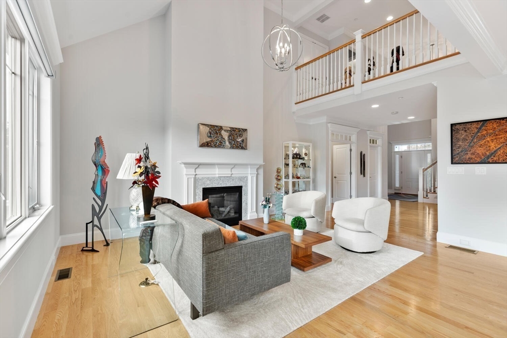 37 Crenshaw Lane, Unit 37 Andover, MA 01810 - Photo 14 of 40 a living room with furniture and a fireplace