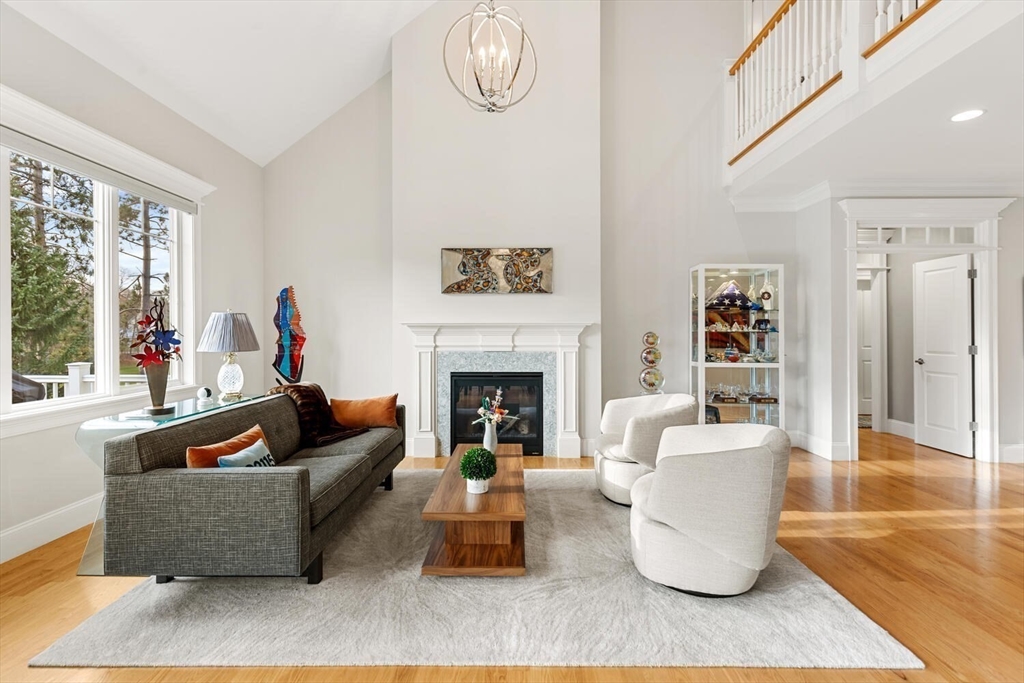 37 Crenshaw Lane, Unit 37 Andover, MA 01810 - Photo 15 of 40 a living room with furniture and a fireplace