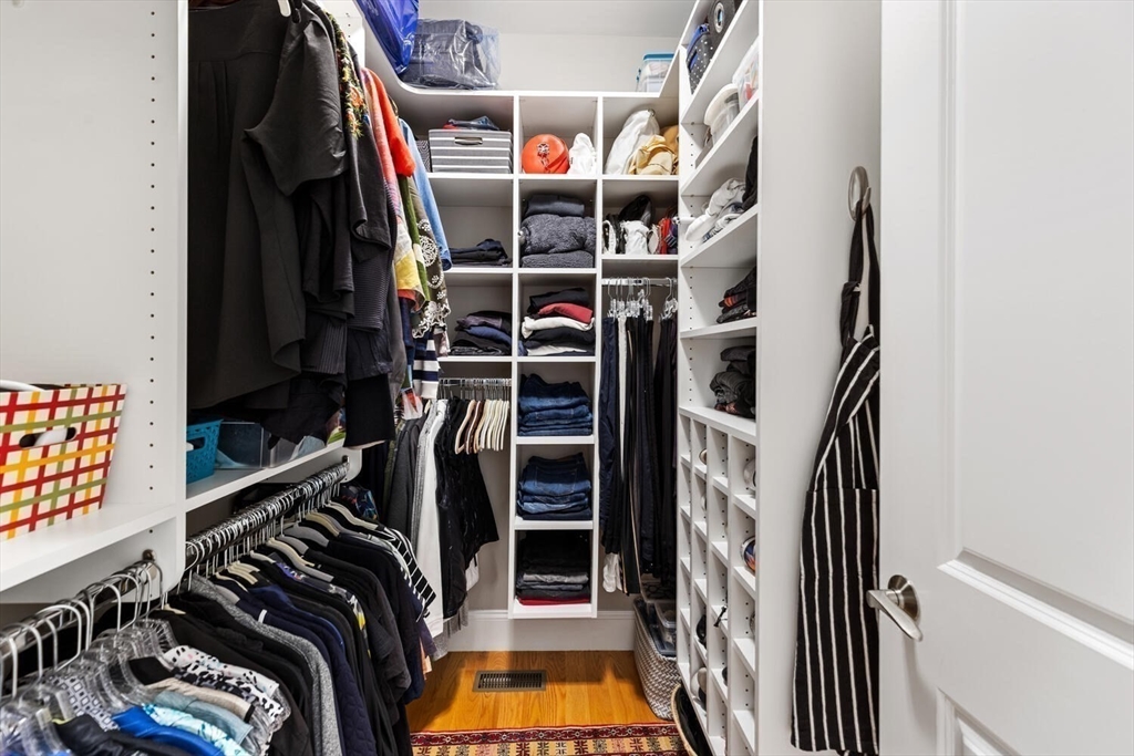 37 Crenshaw Lane, Unit 37 Andover, MA 01810 - Photo 20 of 40 a view of walk in closet with clothes and shoes