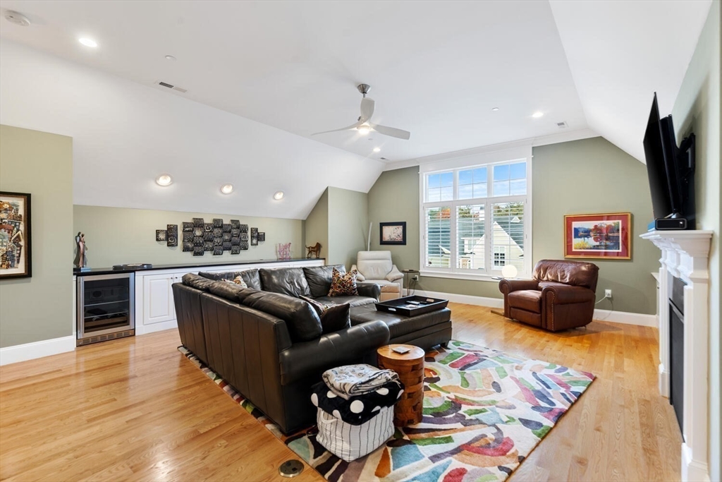 37 Crenshaw Lane, Unit 37 Andover, MA 01810 - Photo 23 of 40 a living room with furniture and a flat screen tv
