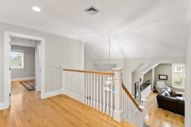 a living room with furniture a flat screen tv and rug