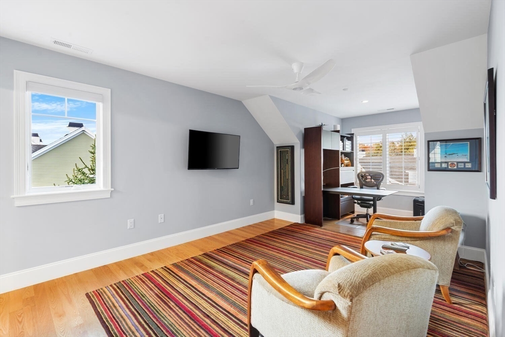37 Crenshaw Lane, Unit 37 Andover, MA 01810 - Photo 27 of 40 a living room with furniture and a flat screen tv