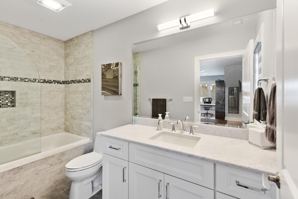 37 Crenshaw Lane, Unit 37 Andover, MA 01810 - Photo 28 of 40 a bathroom with a sink a toilet and shower