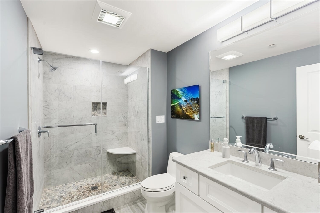 37 Crenshaw Lane, Unit 37 Andover, MA 01810 - Photo 30 of 40 a bathroom with a sink toilet and shower