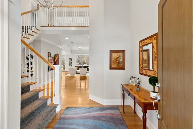 a view of a hallway with windows and stairs