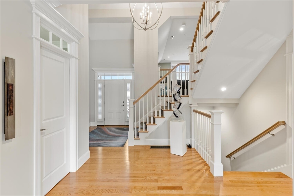 37 Crenshaw Lane, Unit 37 Andover, MA 01810 - Photo 4 of 40 a view of entryway and hall with wooden floor