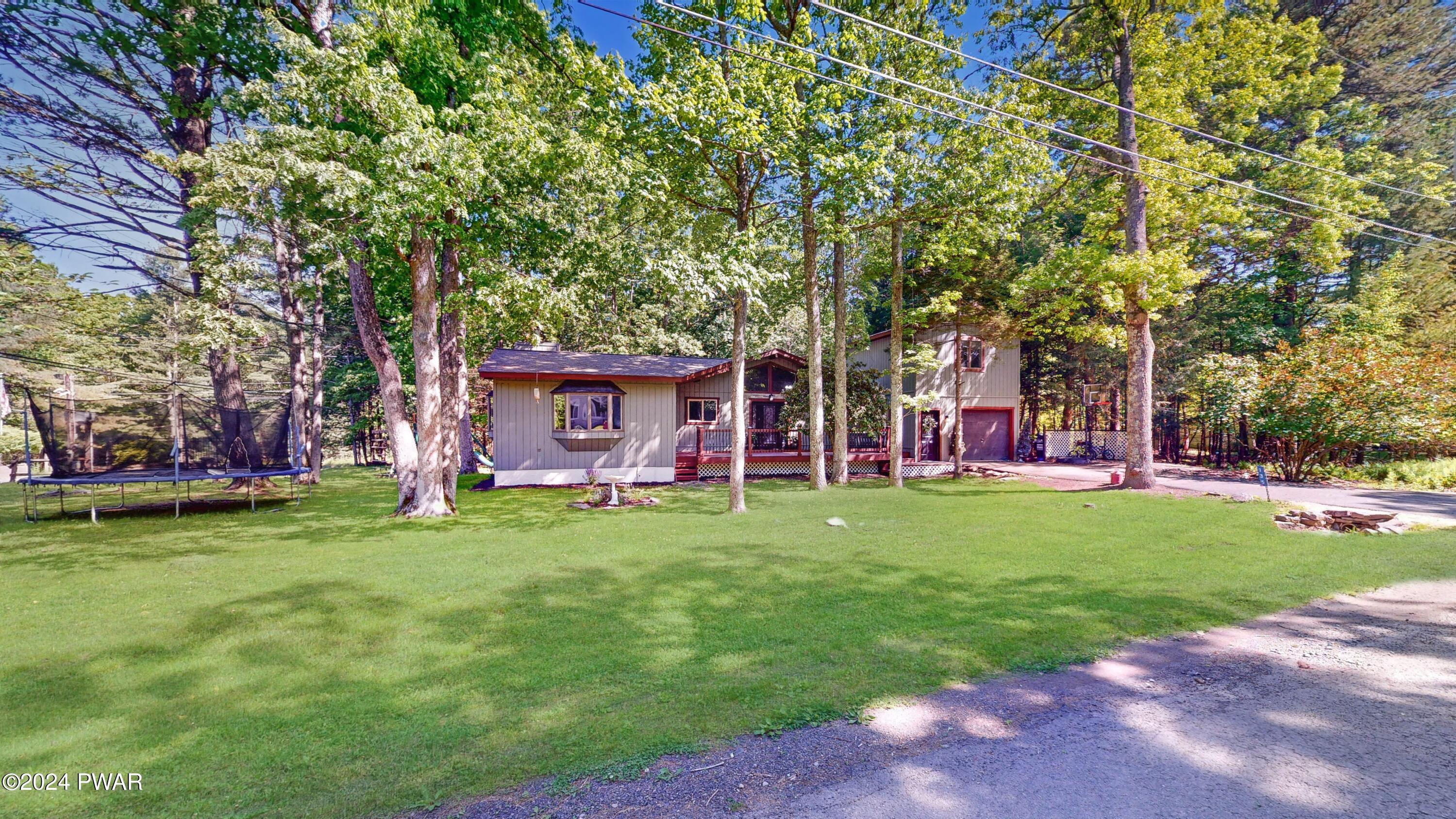 a view of a house with a backyard