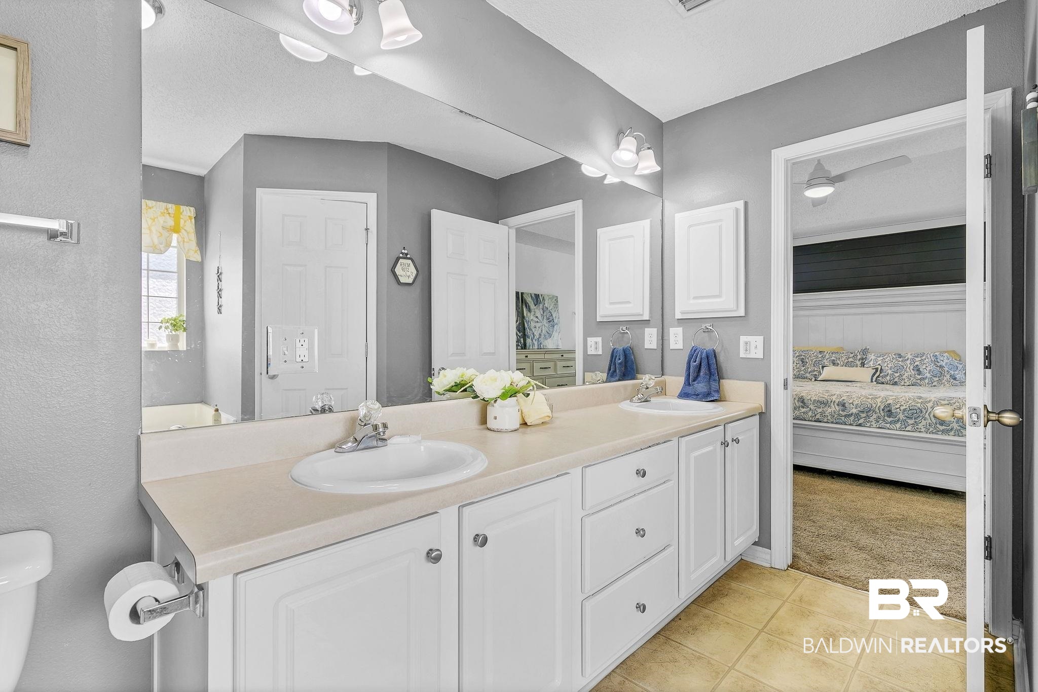 16358 Tempest Drive Foley, AL 36535 - Photo 26 of 46 Ensuite bathroom featuring double vanity, ensuite bath, tile patterned floors, and a sink