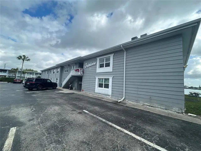 a view of a lake with houses in the back