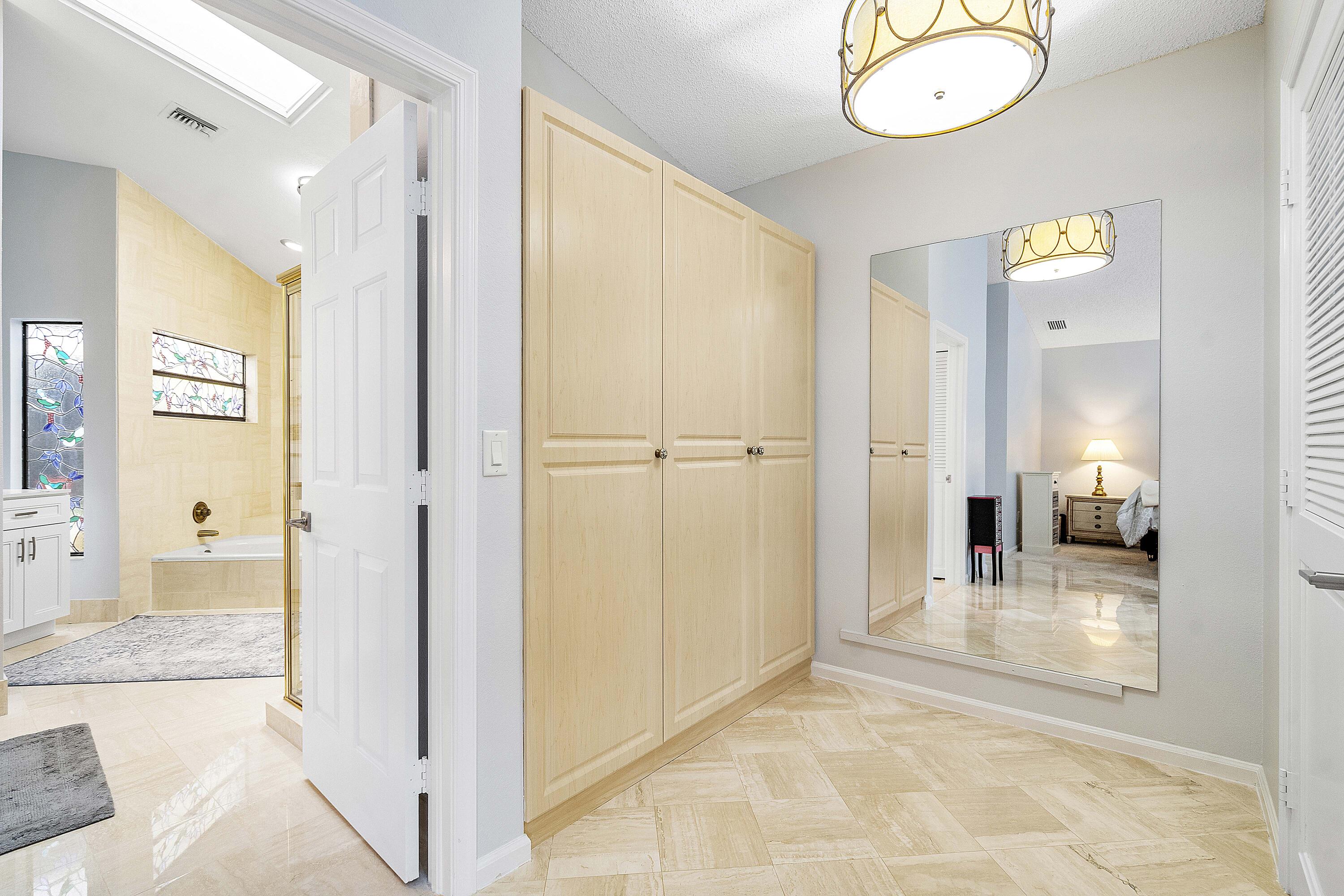 22652 Esplanada Circle Boca Raton, FL 33433 - Photo 12 of 44 a view of a hallway with wooden floor and living room