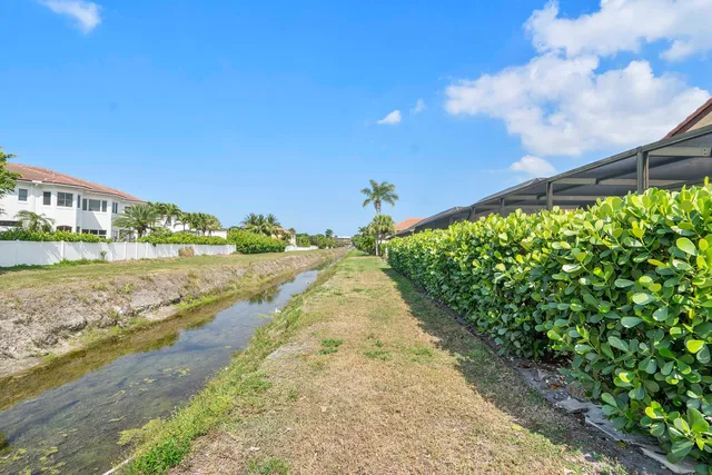 a view of a street with a big yard