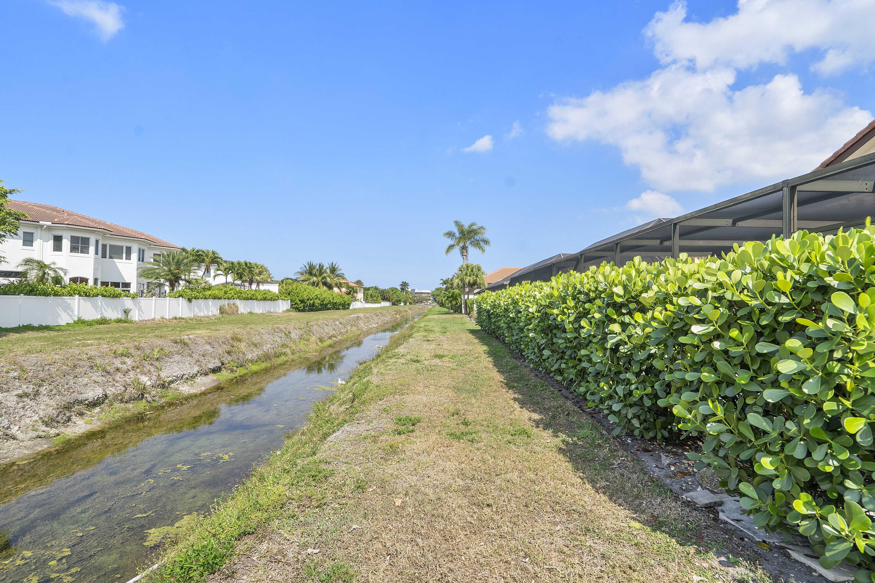 22652 Esplanada Circle Boca Raton, FL 33433 - Photo 18 of 44 a view of a street with a big yard