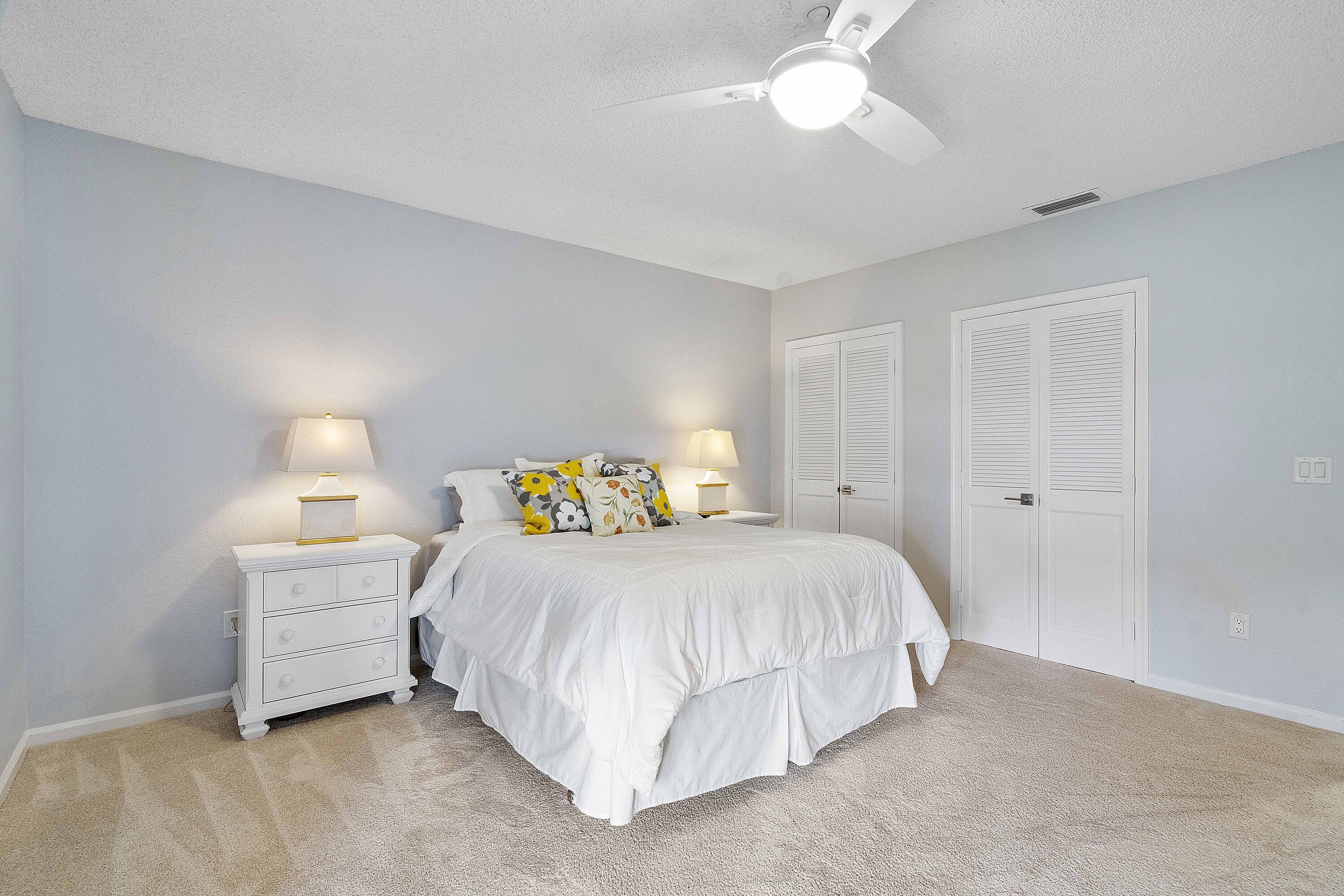 22652 Esplanada Circle Boca Raton, FL 33433 - Photo 21 of 44 a bedroom with a bed and a window