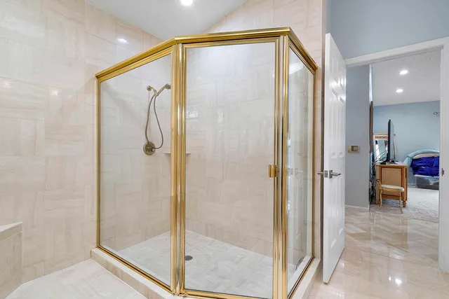 a bathroom with a shower and a sink