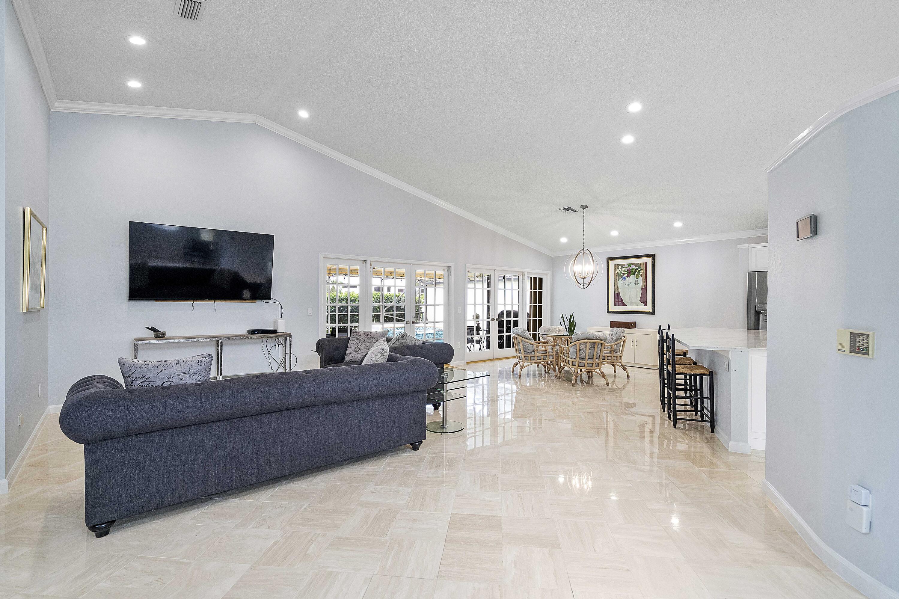 22652 Esplanada Circle Boca Raton, FL 33433 - Photo 29 of 44 a living room with furniture and a flat screen tv
